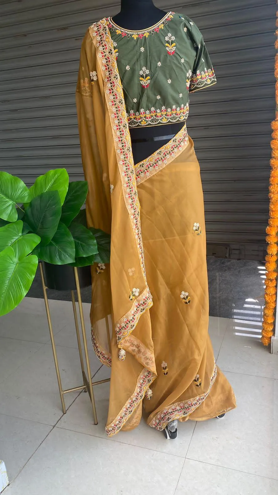 Light orange organza saree with silk embroidery blouse