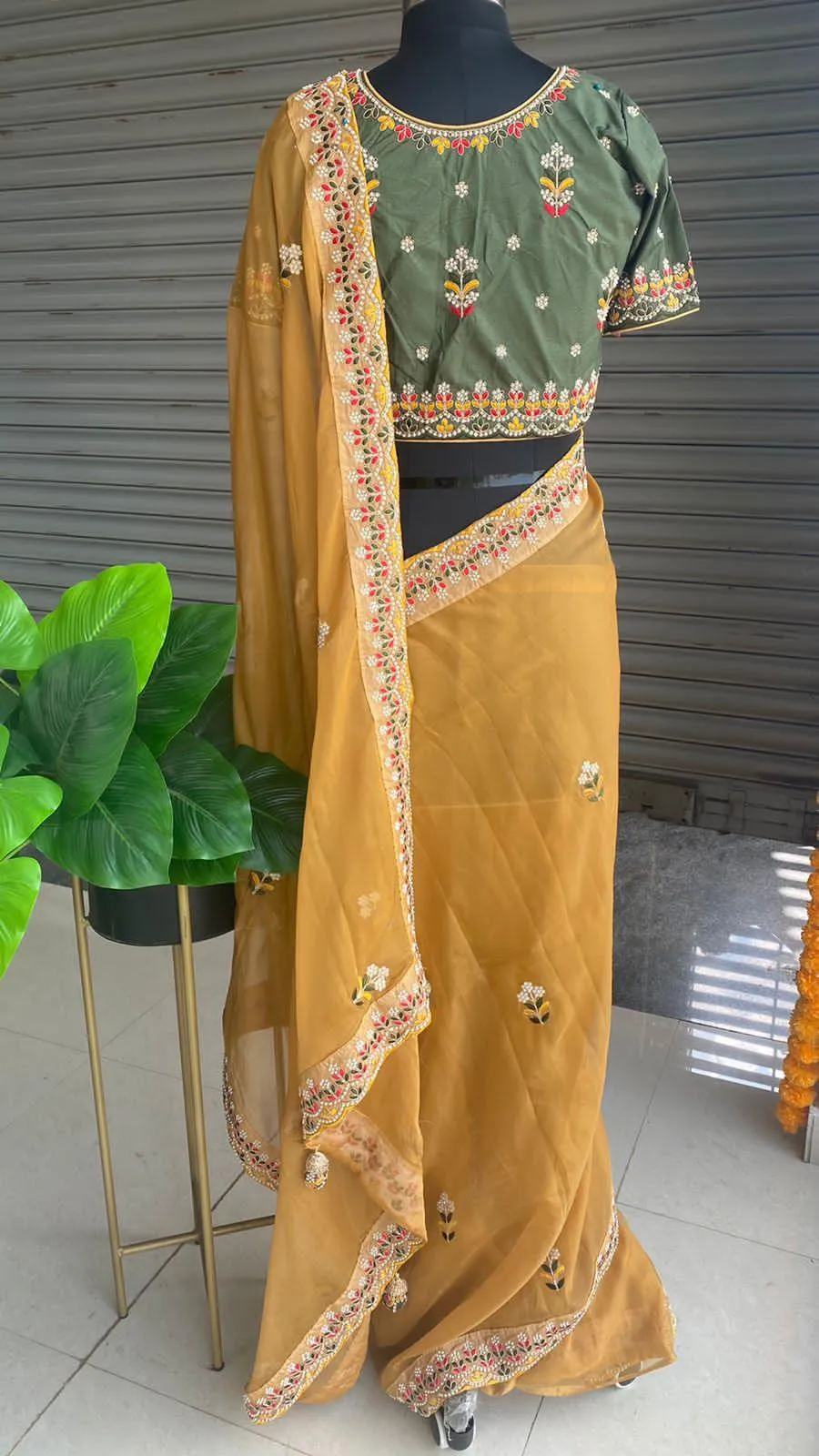 Light orange organza saree with silk embroidery blouse